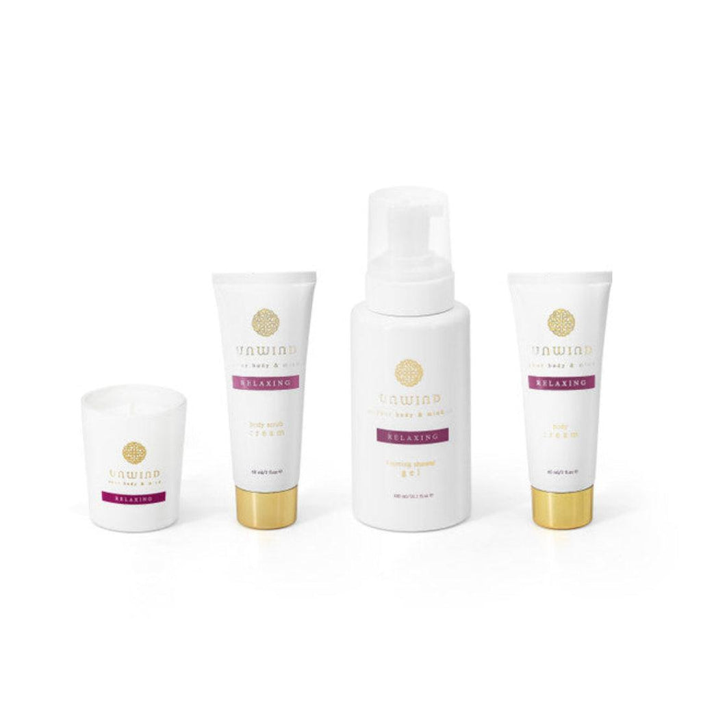Set of skincare products with 'unwind' branding on a white background