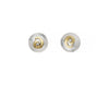 A pair of round stud earrings with textured silver-toned outer discs and a central gold-toned spiral detail holding a small clear gemstone, shown on a plain white background.